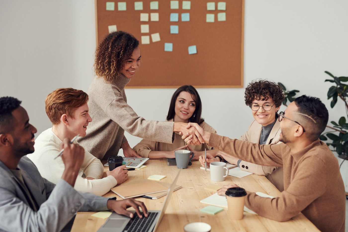 Product team collaborating around laptops